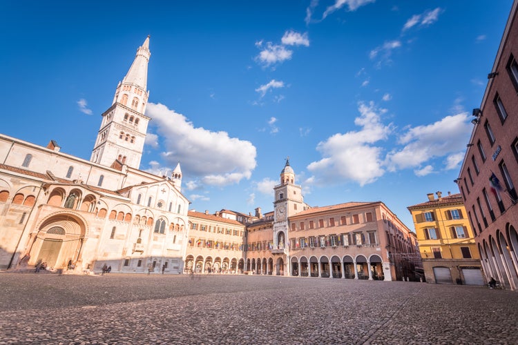 Modena, Emilia Romagna, Piazza Grande illuminated at sunset, with Cathedral Duomo and Ghirlandina Leaning Tower