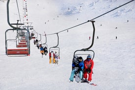 Photo of aerial view of beautiful winter landscape of Les Deux Alpes surrounded by mountains, France.