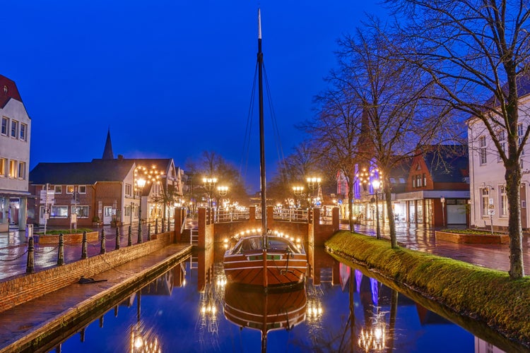 Photo of Canal with historical barge and bridge in Papenburg,Germany