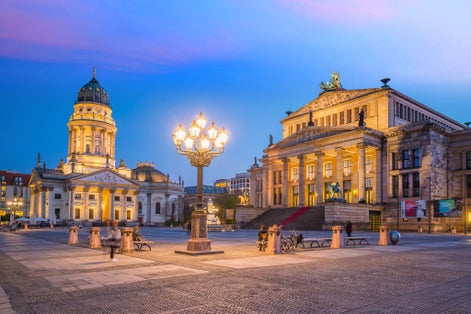 Photo of Panoramic view of famous Gendarmenmarkt square at night in Berlin Mitte district, Germany