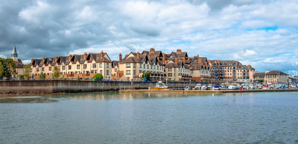 photo of panorama of the waterfront of Malahide, with beautiful seafront homes. Malahide is an affluent coastal settlement in Fingal, County Dublin, Ireland.