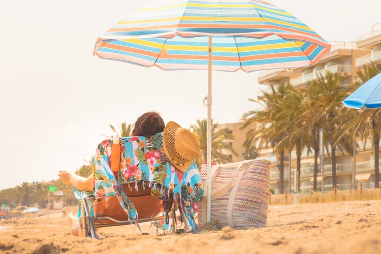 Relaxing on vacation on one of Costa Daurada's beaches.