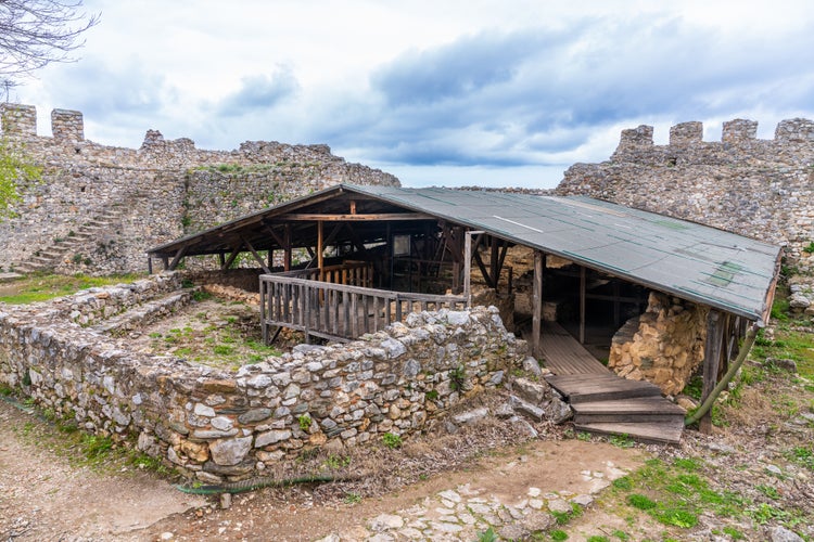 photo of view of Neos Panteleimonas, Greece - 18 March 2023 -Remains of a bathhouse at the Byzantine Castle of Platamon, Neos Panteleimonas, Greece.