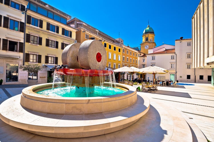 Photo of Rijeka square and fountain view with clock tower gate, Kvarner, Croatia.