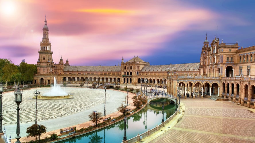 Photo of scenic view of Plaza de España .The Plaza de España is a plaza in the Parque de María Luisa, Historical landmark in Seville.