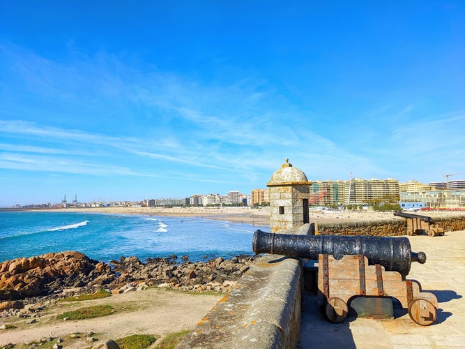 Queijo fort on the Matosinhos beach, cityscape and port Leixoes in background, Porto, Portugal