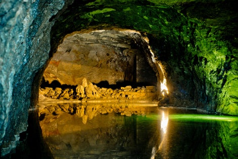 Rock wall reflected in underground lake in Hinterbruhl seegrotte. Lower Austria