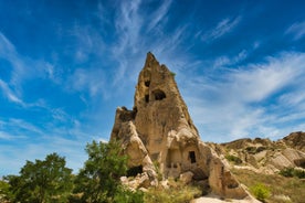 Hot air balloons flying over Uchisar Castle. Cappadocia. Nevsehir Province. Turkey.