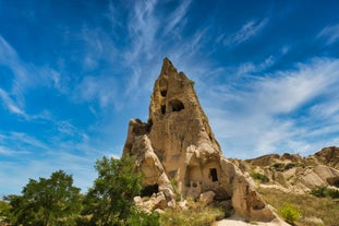 Hot air balloons flying over Uchisar Castle. Cappadocia. Nevsehir Province. Turkey.