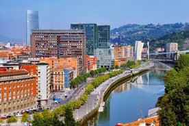 Photo of aerial view of Vizcaya bridge over the river and cityscape at Portugalete, Spain.