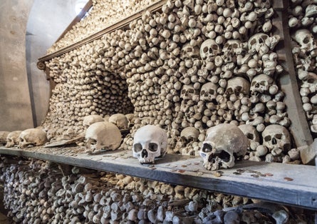 Photo of Sedlec Ossuary, Church of Bones in Kutna Hora, designed by real human skeleton bones, Czech Republic.