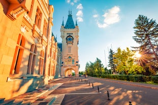 Photo of Water fountain in central square in Iasi town, Cultural Palace in background, Moldavia, Romania.