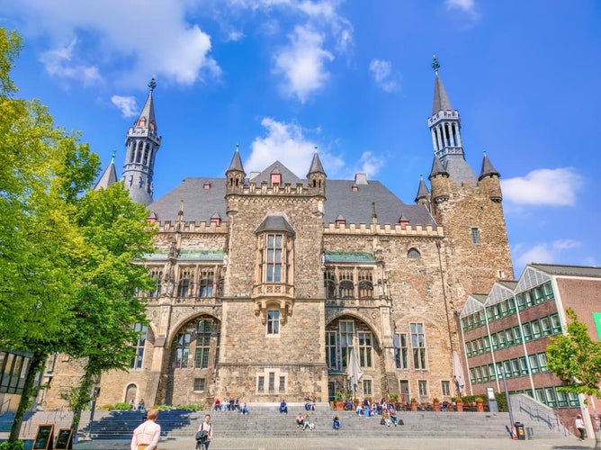 Photo of city hall of Aachen with unidentified people. It is one of the most striking structures in the old town of Aachen,Germany