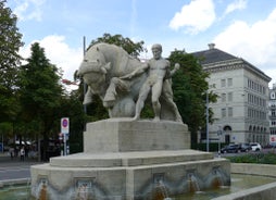 Panoramic view of historic Zurich city center with famous Fraumunster, Grossmunster and St. Peter and river Limmat at Lake Zurich on a sunny day with clouds in summer, Canton of Zurich, Switzerland