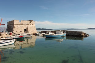 photo of a beautiful panoramic view of Kastel Luksic harbor and landmarks summer view, Split region of Dalmatia, Croatia.