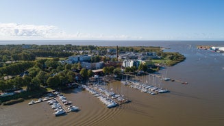 Scenic summer view of the Old Town and sea port harbor in Tallinn, Estonia.