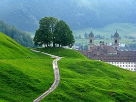 photo of the villages Schwyz and Rickenbach with the mountains Grosser Mythen and Kleiner Mythen in the background in Switzerland.