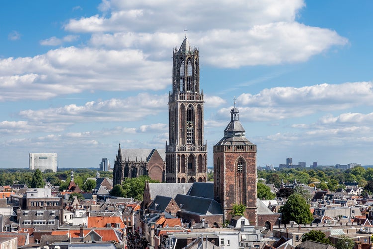 photo of view of UTRECHT, NETHERLANDS - MAY 25, 2013: Zadelstraat street leading to the tower of Utrecht, the Netherlands.