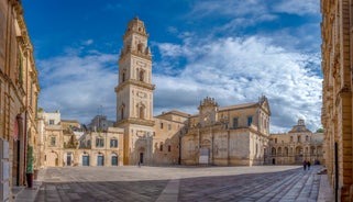 Photo of panoramic view of the ancient town of Matera (Sassi di Matera), European Capital of Culture 2019, in beautiful golden morning light with blue sky and clouds, Basilicata, southern Italy.