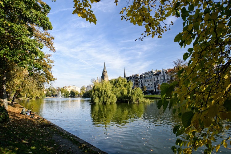 Photo of Ixelles pond in October with Church reflection in water, Belgium.