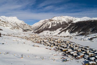 Photo of aerial view of Livigno town covered in snow in winter, Italy.