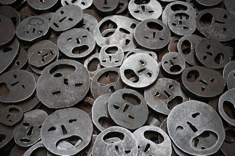 Round iron that resembles the shape of a sad face.
