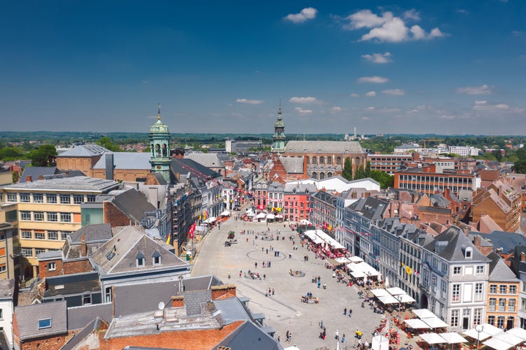 Aerial skyline summer view of vibrant central square (Grand-Place de Mons) and town hall of Mons (Bergen). Wallonia, capital of Hainaut, Belgium.