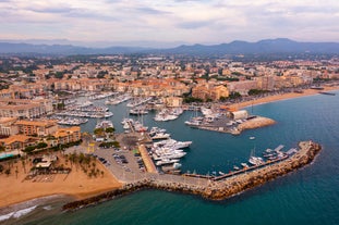 Photo of aerial cityscape view on French riviera with yachts in Cannes city, France.