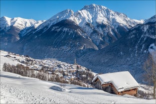 Photo of  beautiful Scuol town in Swiss Alps and Inn river, Switzerland.