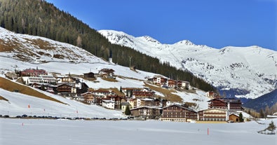 Photo of panorama of Hintertux ski resort in Zillertal Alps in Austria with the far view of ski lifts and pistes.