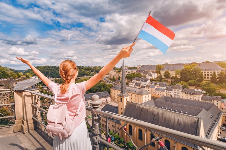 Photo of girl holds the flag of Luxembourg ,recreation and life in the country.