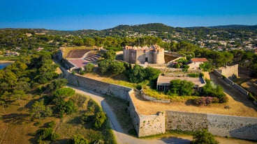 Photo of beautiful aerial view of Saint-Tropez, France with seascape and blue sky.