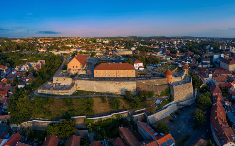 Photo of Amazing cityscape about Eger city in Hungary. Fantastic famous attractions are here. Turkish bath minaret University basilica ferris wheel adn much more.