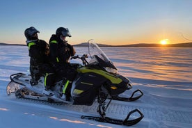 Kiruna: Guided Snowmobile Tour and Swedish Fika Experience