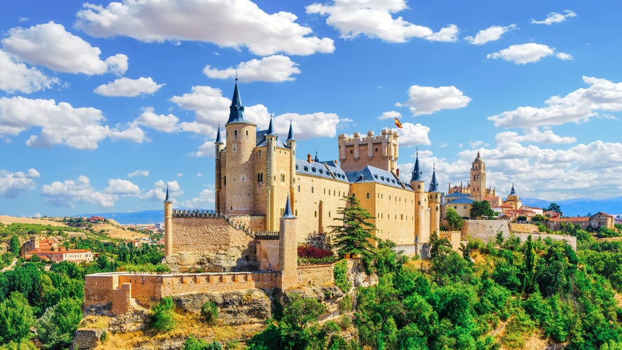 photo of view of Alcazar Palace and fortress of the Spanish kings in the historical part of Segovia. Spain.