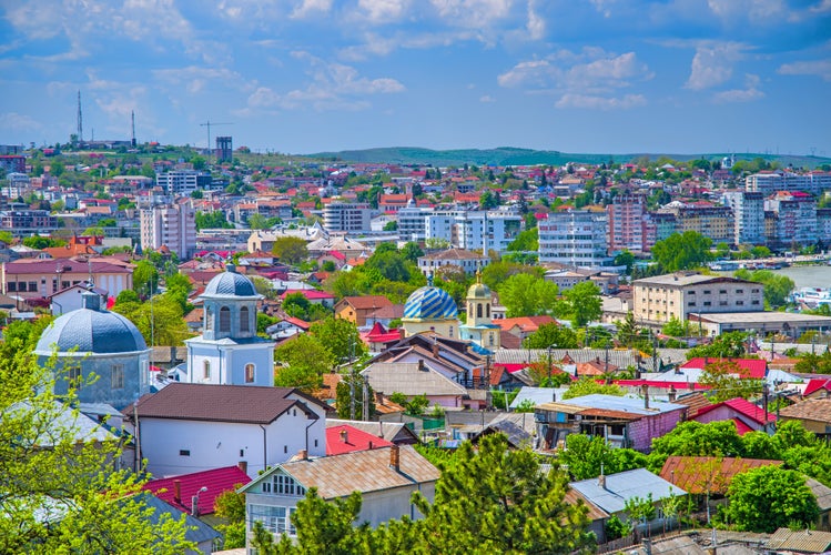 Photo of aerial view over the city of Tulcea in Romania, old and new buildings cityscape.