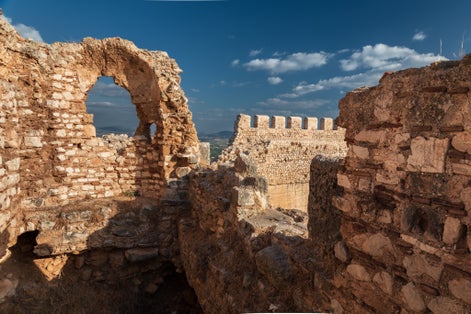 Photo of Well-preserved ruins of the ancient Greek fortress Larisa with stone walls and towers, Argos, Greece.