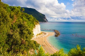 photo of majestic sunrise in Numana public beach. Picturesque summer seascape of Adriatic Sea. Colorful outdoor scene of Italy, Europe.