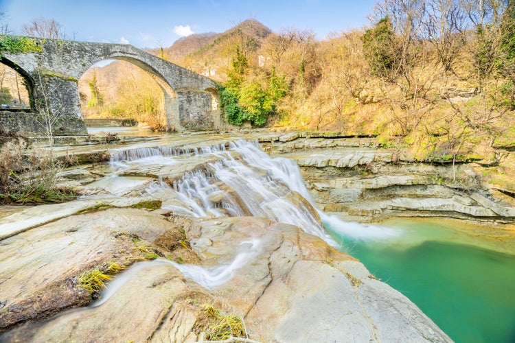 Photo of Brusia waterfalls and Bridge in mountains of Forlì.