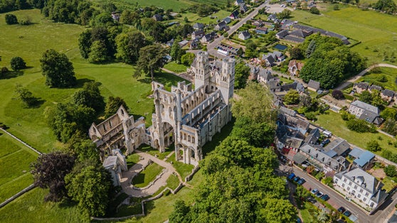 The ruins of the medieval Benedictine Abbey in Jumièges (Normandy, France) one of the most famous monuments of this region, aerial view taken in May