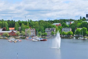 Early autumn morning panorama of the Port of Turku, Finland, with Turku Castle at background.