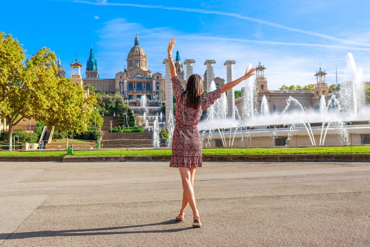 Photo of tourist woman on Montjuic hill. Populal sight in Barcelona, Spain.