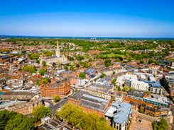 Photo of aerial view of the village of Painswick and the Cotswold escarpment towards Sheepscombe, The Cotswolds, United Kingdom.