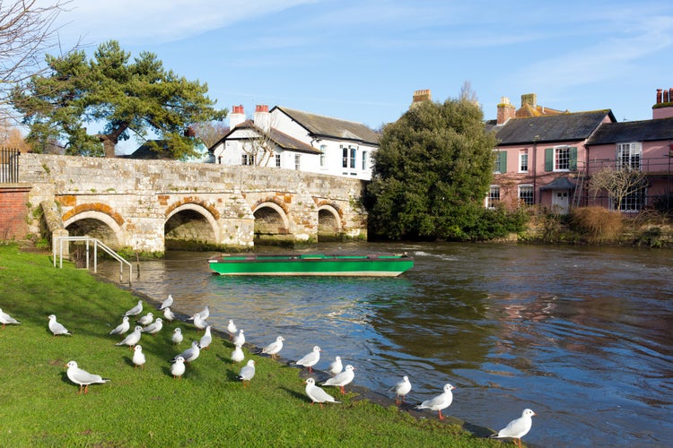 Photo of Christchurch Dorset England UK River Avon with bridge near to Bournemouth and the New Forest.