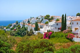 Photo of aerial view of the town of Nerja with the beautiful beach, Málaga, one of the white villages of Andalusia, Spain.