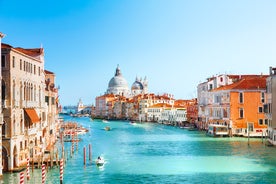 Photo of beautiful view of canal with statues on square Prato della Valle and Basilica Santa Giustina in Padova (Padua), Veneto, Italy.