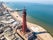 Photo of aerial view of the Blackpool Tower with the Central pier in the background located in Blackpool, UK.