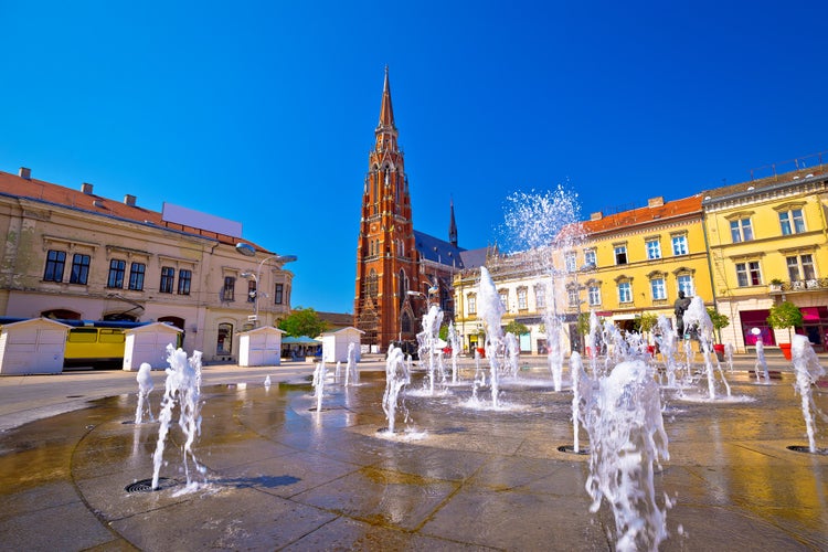 Photo of Osijek main square fountain and cathedral view, Slavonija region of Croatia.