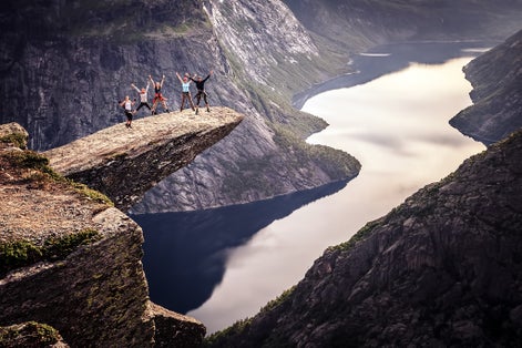 People on rocks harsh Norway, Trolltunga