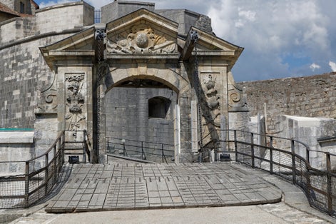photo of view of Drawbridge in Fort de Joux. The castle commands the mountain pass Cluse de Pontarlier and was improved by famous architect Vauban.